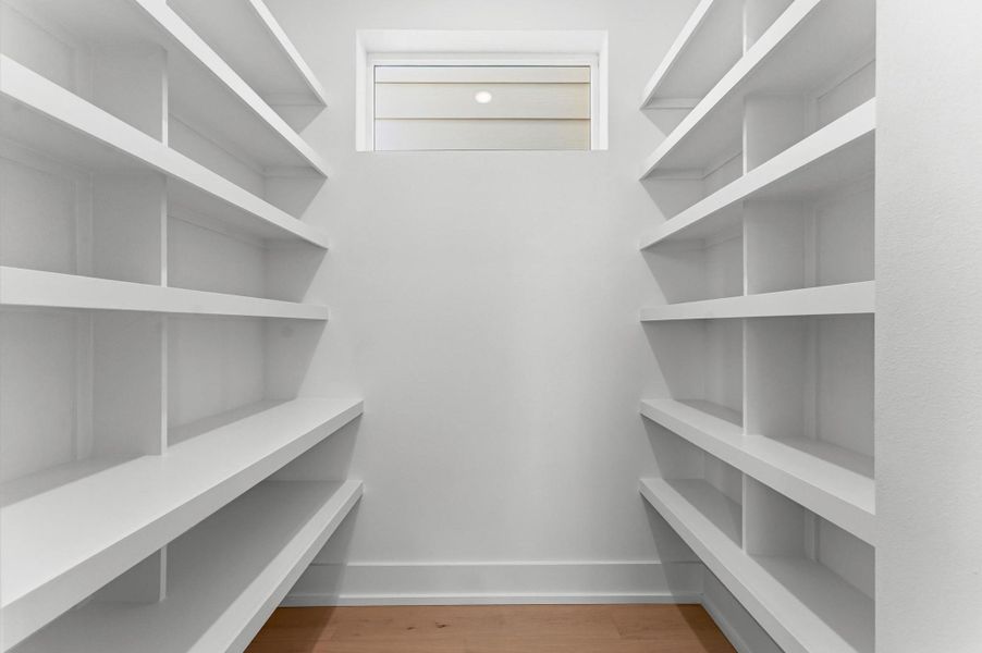 Walk-in closet in secondary bedroom