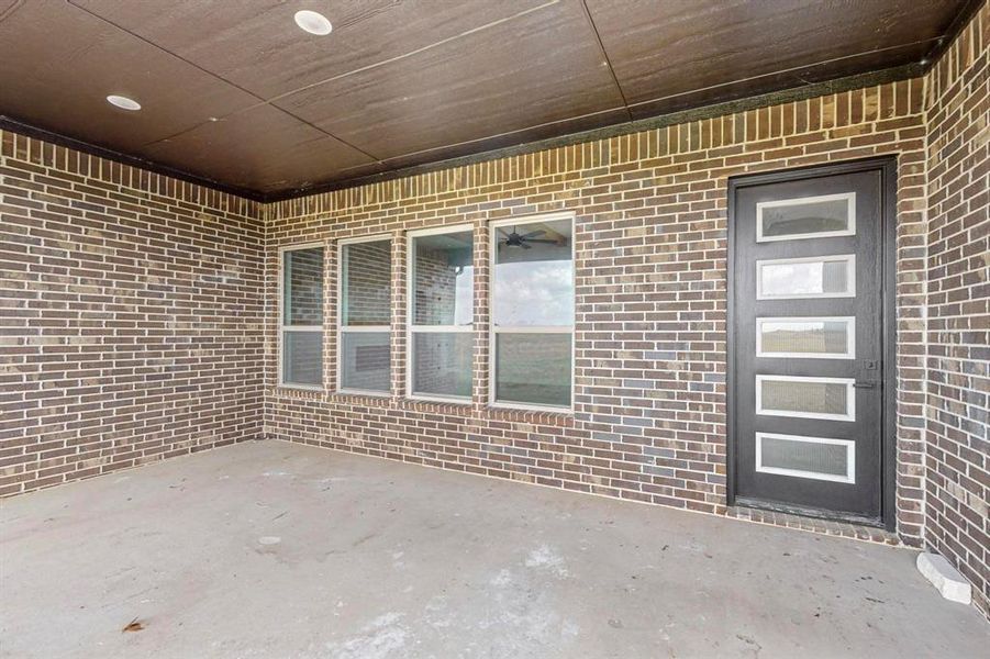 Property entrance featuring a patio area