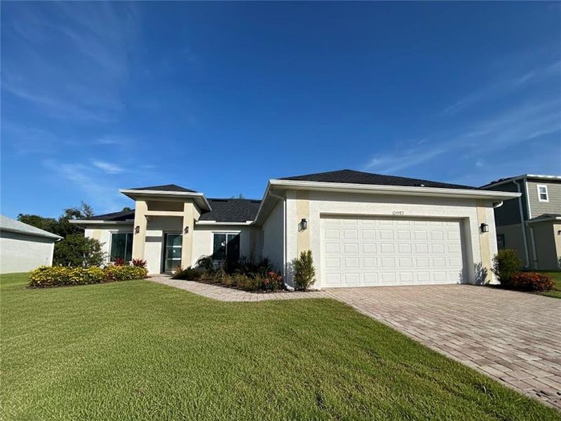 Front exterior of a new home in , Punta Gorda, FL, highlighting curb appeal (Image 1). Front exterior of a new home in , Punta Gorda, FL, highlighting curb appeal (Image 1).