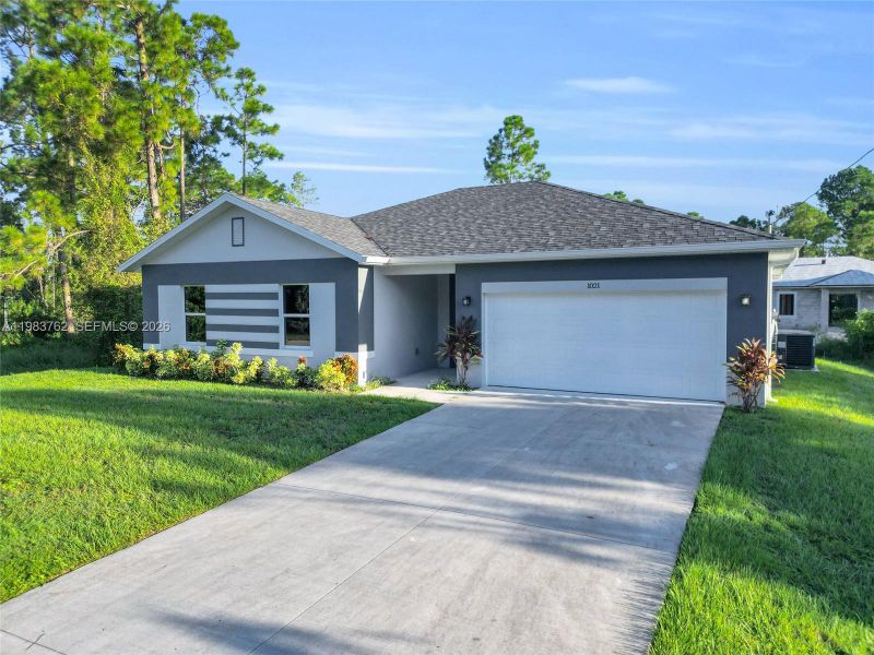 Front exterior of a new home in , Lehigh Acres, FL, highlighting curb appeal (Image 20).
