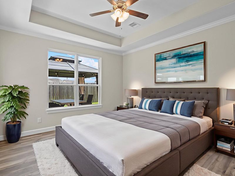 The Promenade III's primary suite offers a luxurious retreat with a spacious layout and a serene ambiance designed for ultimate relaxation. *Image depicts home as-is virtually staged.
