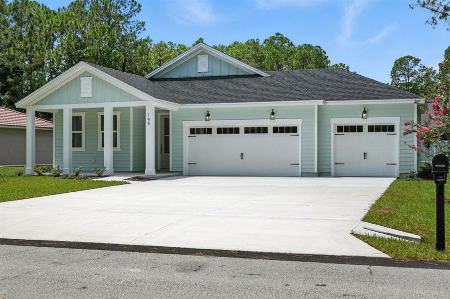 Front exterior of a new home in Palm Coast Homes, Palm Coast, FL, highlighting curb appeal (Image 23).