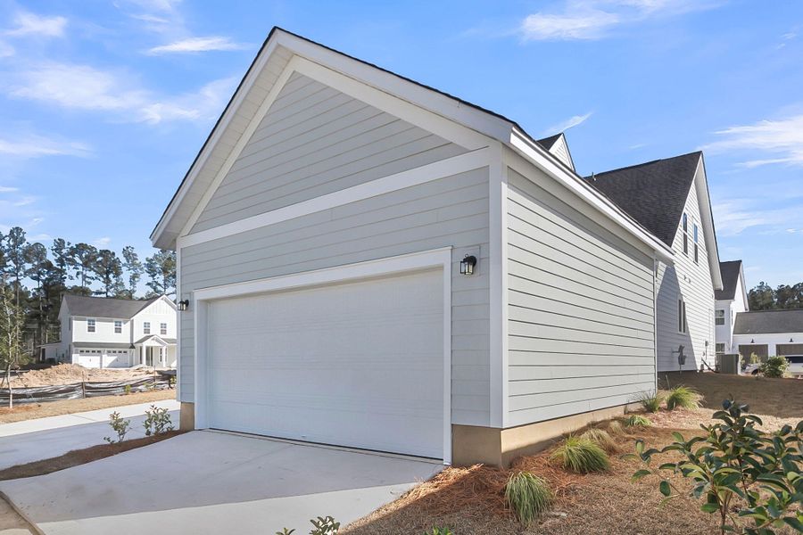 Front exterior of a new home in Midtown at Nexton, Summerville, SC, highlighting curb appeal (Image 15).