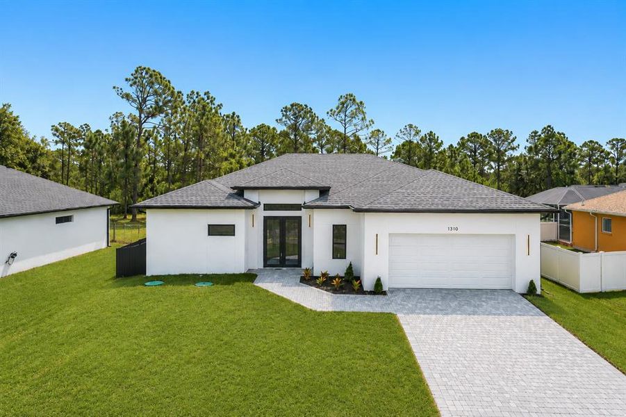 Front exterior of a new home in , North Port, FL, highlighting curb appeal (Image 1). Front exterior of a new home in , North Port, FL, highlighting curb appeal (Image 1).