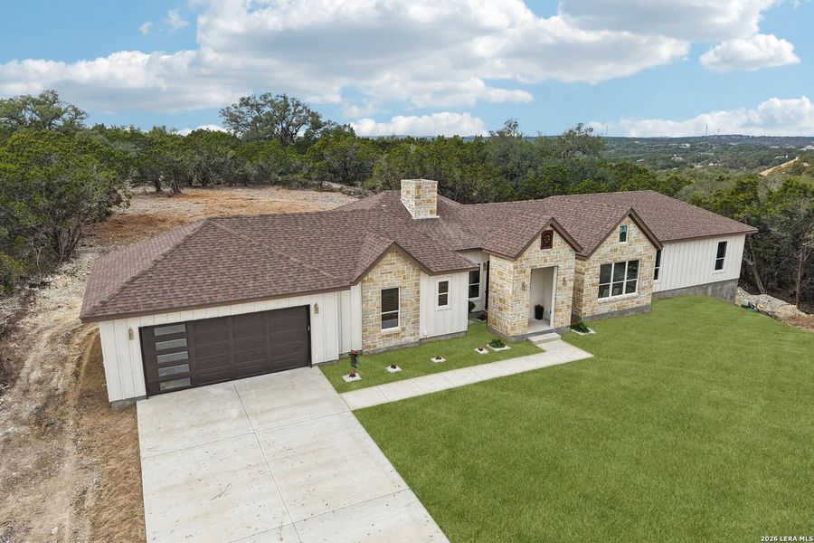 Front exterior of a new home in , Fischer, TX, highlighting curb appeal (Image 23).