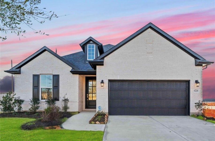 Front exterior of a new home in Arabella on the Prairie, Booth, TX, highlighting curb appeal (Image 2).