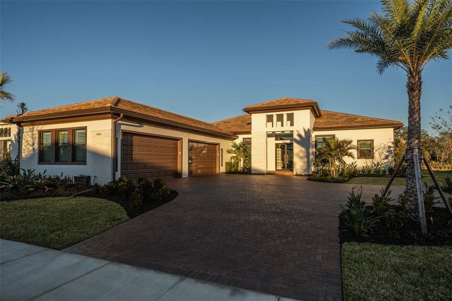 Front exterior of a new home in , Sarasota, FL, highlighting curb appeal (Image 26).