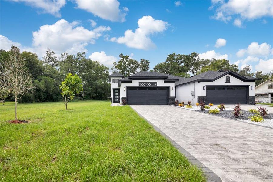 Front exterior of a new home in , Apopka, FL, highlighting curb appeal (Image 38).