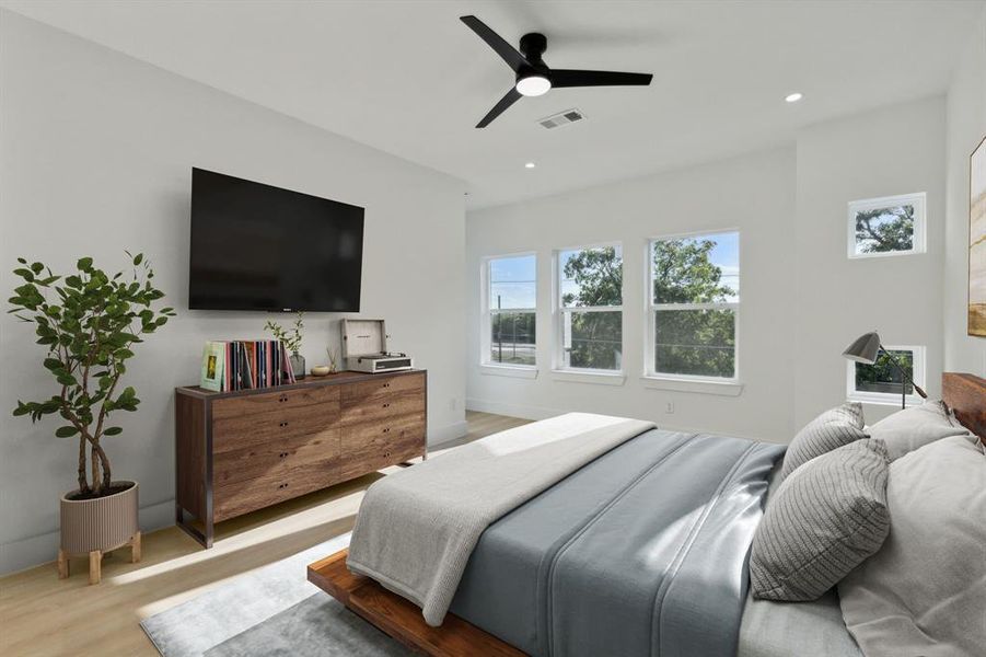 Bedroom featuring light hardwood / wood-style floors and ceiling fan