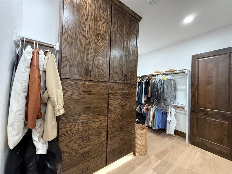 Walk in closet featuring light wood-type flooring