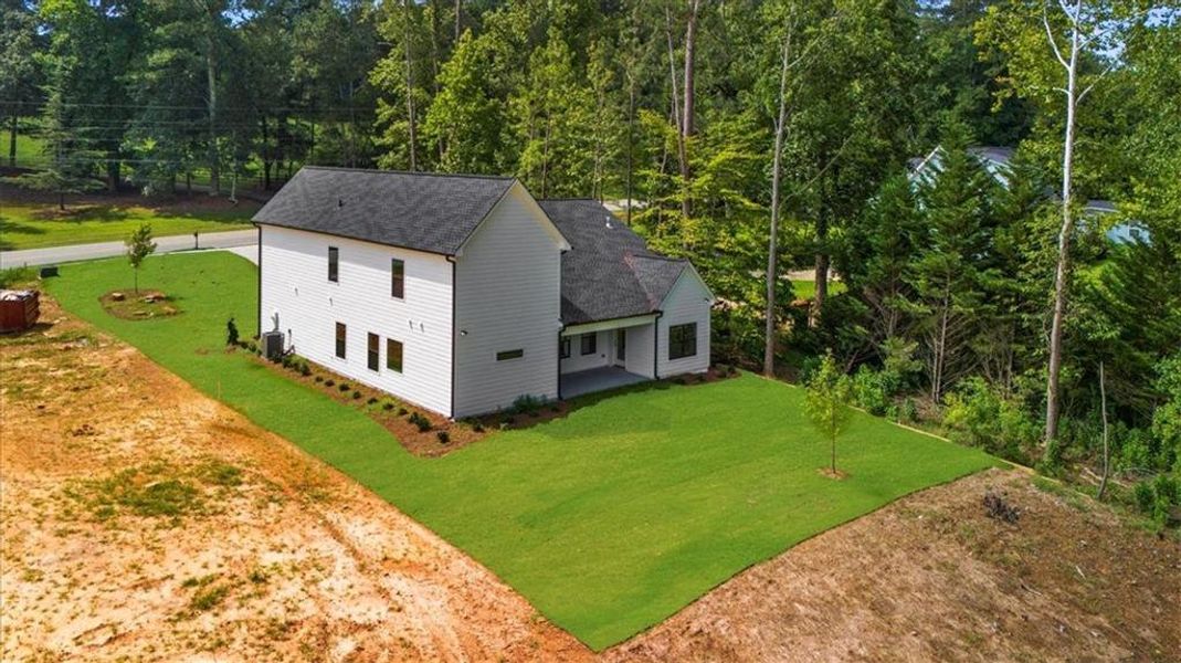 Front exterior of a new home in , Sugar Hill, GA, highlighting curb appeal (Image 24). Front exterior of a new home in , Sugar Hill, GA, highlighting curb appeal (Image 24).