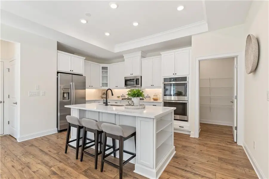 Furnished interior in a model home at The Courtyards by The Manor in Alpharetta (Image 3).