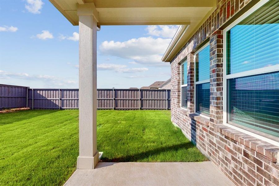 Exterior details and patio area of a home in Prairie Ridge at Goodland, Venus (Image 3).