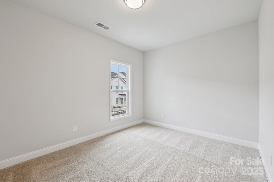 Spacious, unfurnished interior of a new home in Walk23, Huntersville (Image 13).