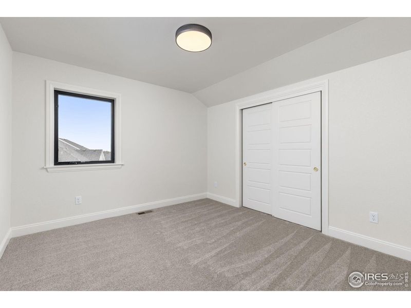 Spacious, unfurnished interior of a new home in Cottages at Kelly Farm, Greeley (Image 31).