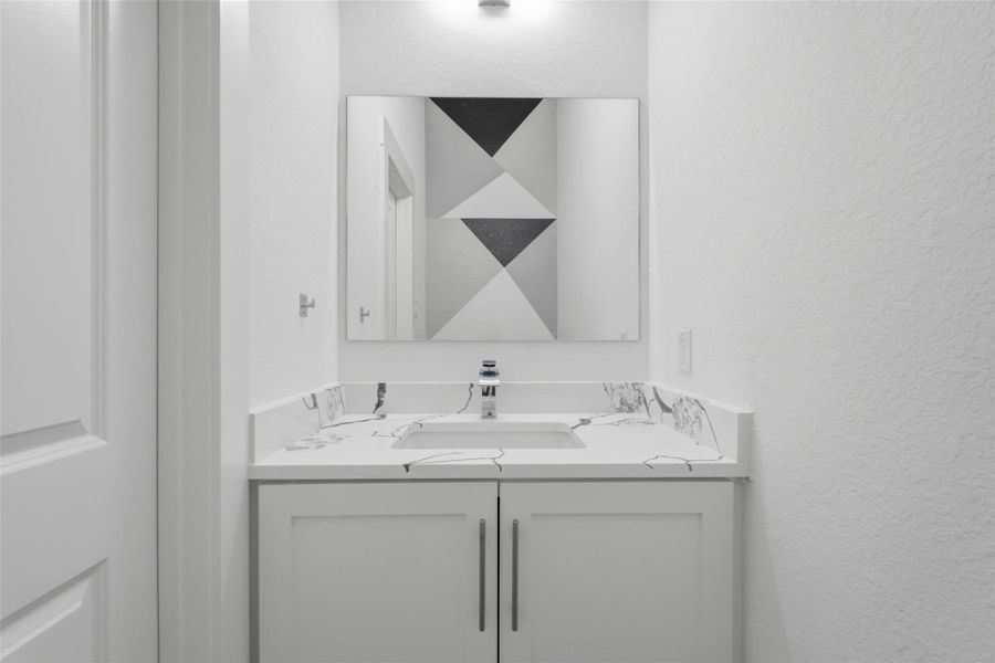Convenient first-floor powder bath. Convenient first-floor powder bath.