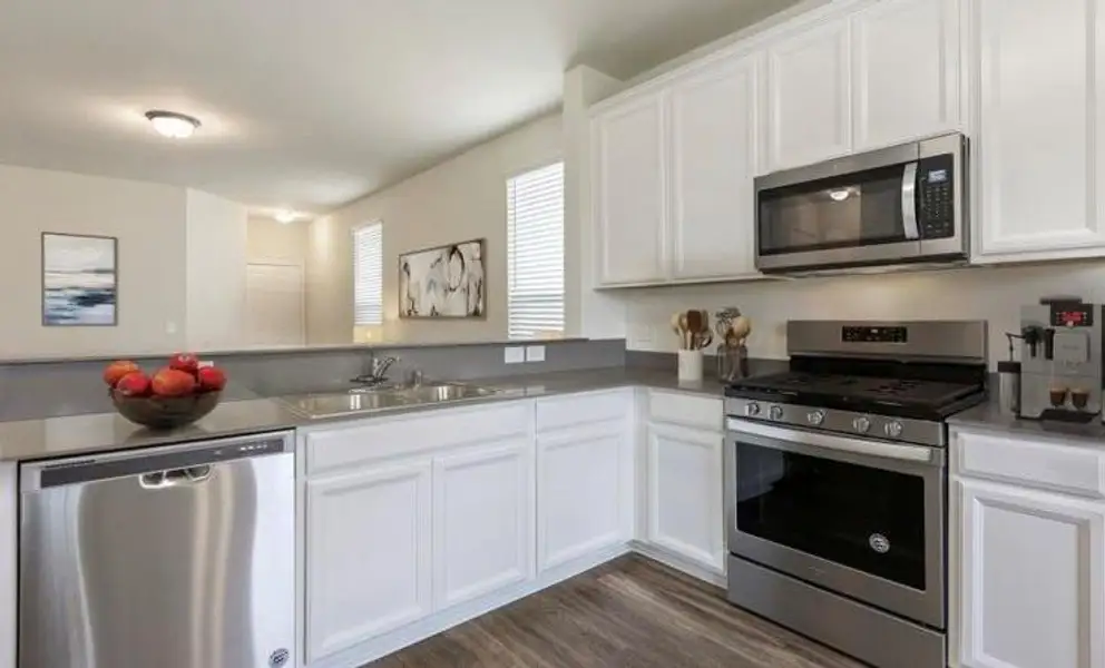 Furnished interior view inside a new home in The Pines At Seven Coves, Conroe (Image 7).
