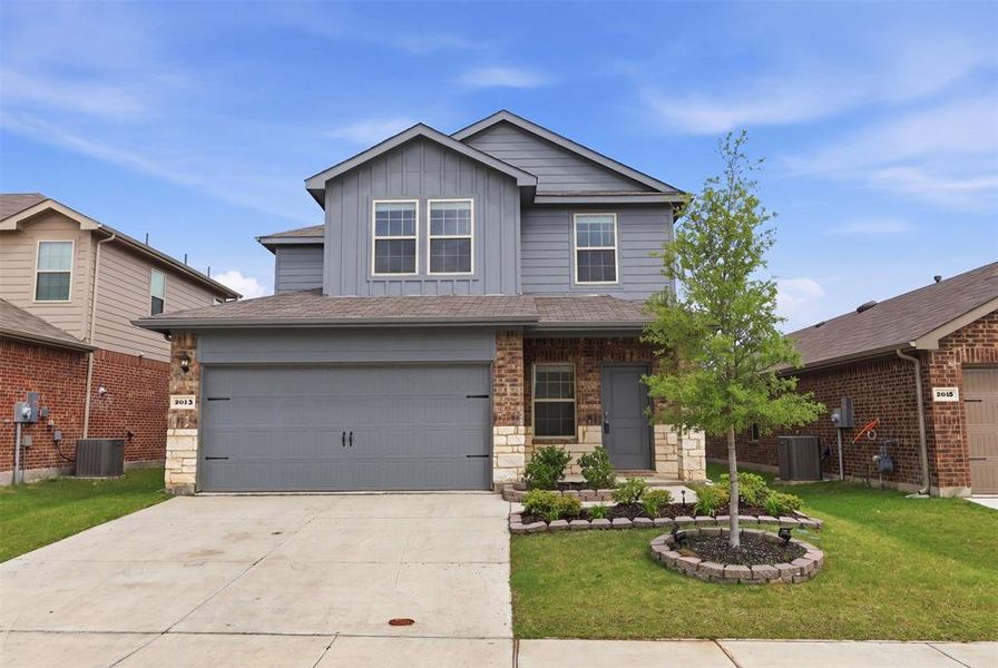 Front exterior of a new home in Wildcat Ranch, Crandall, TX, highlighting curb appeal (Image 1). Front exterior of a new home in Wildcat Ranch, Crandall, TX, highlighting curb appeal (Image 1).