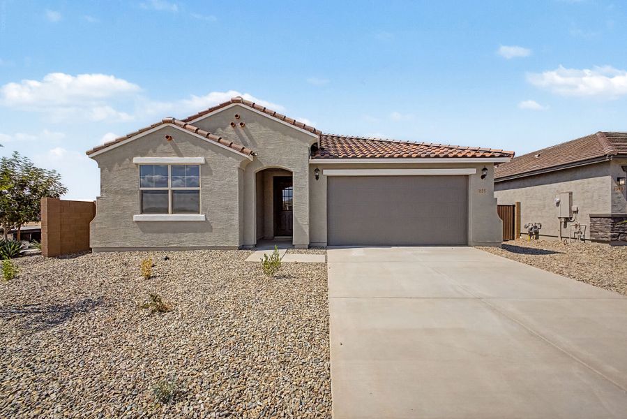 Front exterior of a new home in Landmarke, San Tan Valley, AZ, highlighting curb appeal (Image 1). Front exterior of a new home in Landmarke, San Tan Valley, AZ, highlighting curb appeal (Image 1).