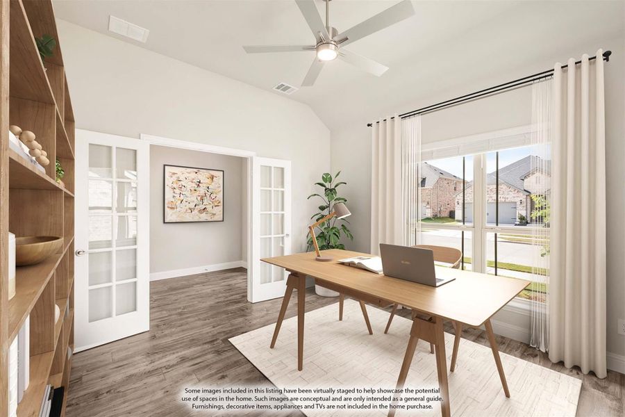 Home office with vaulted ceiling, French doors, wood desk, and large window with natural light