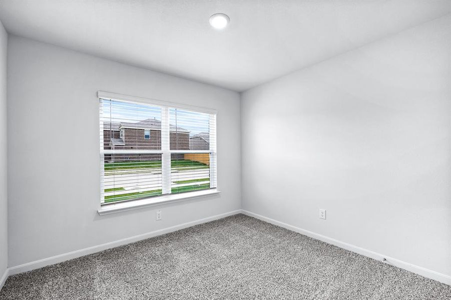 Carpeted empty room with plenty of natural light