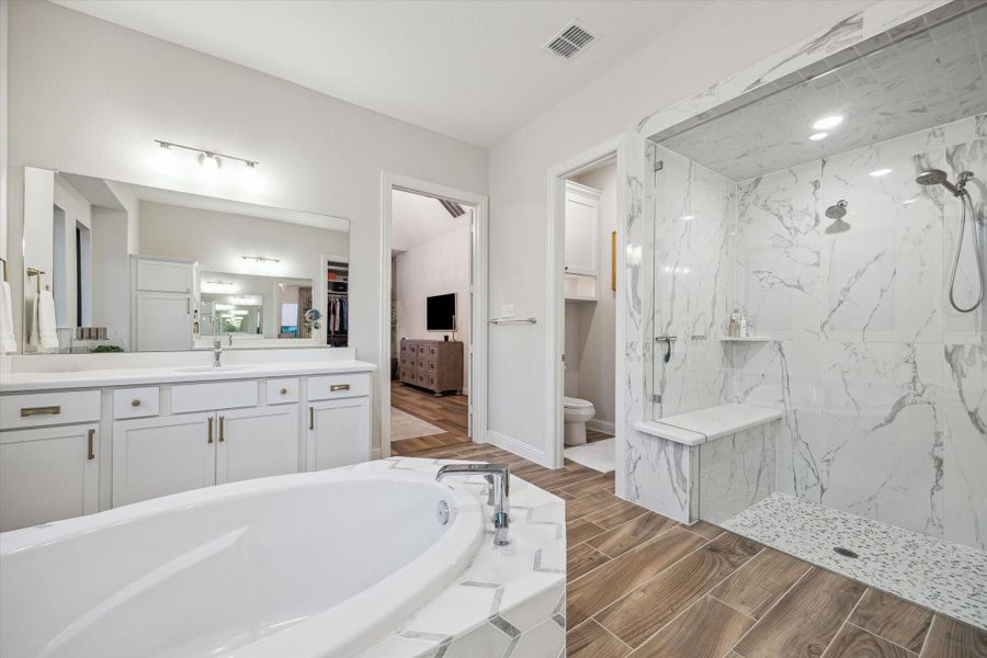 Oversized primary bathroom with soaking tub and extended shower Oversized primary bathroom with soaking tub and extended shower