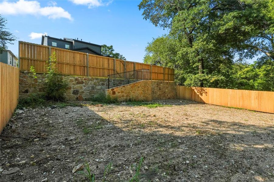 View of fenced backyard