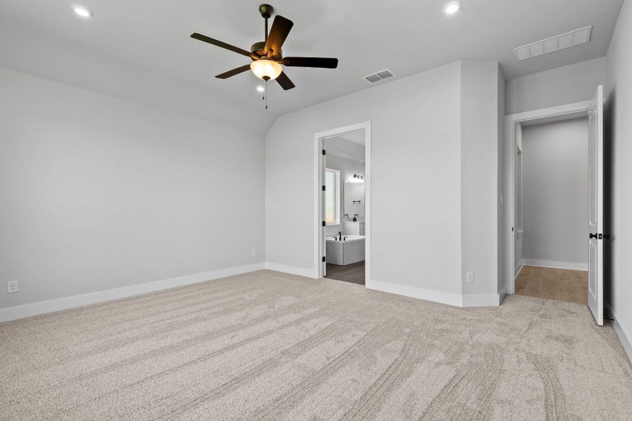 Primary Bedroom with elevated ceiling Primary Bedroom with elevated ceiling