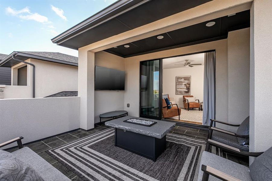 View of patio / terrace with an outdoor living space with a fire pit