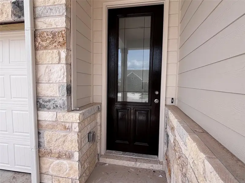 Exterior details and patio area of a home in The Colony, Bastrop (Image 3).