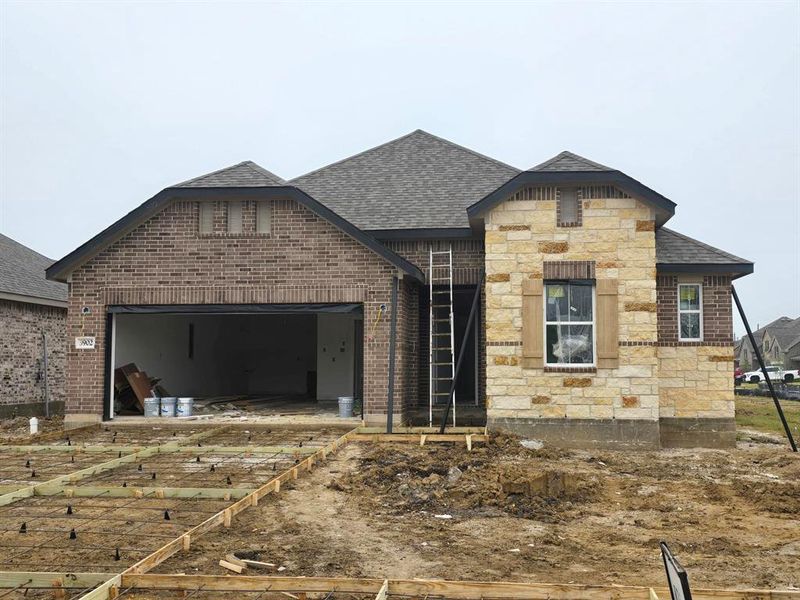 One story home with 3 bedrooms, 2.5 baths, and 3-car tandem garage.