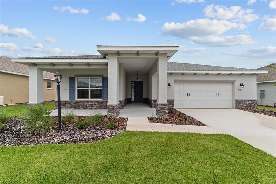 Front exterior of a new home in , Ocala, FL, highlighting curb appeal (Image 2). Front exterior of a new home in , Ocala, FL, highlighting curb appeal (Image 2).