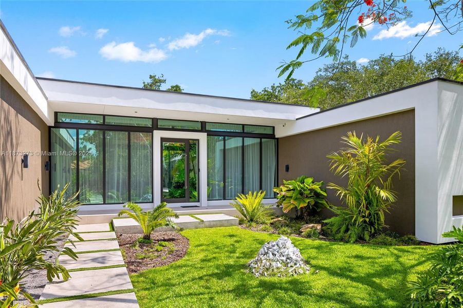 Front exterior of a new home in , Pinecrest, FL, highlighting curb appeal (Image 26).