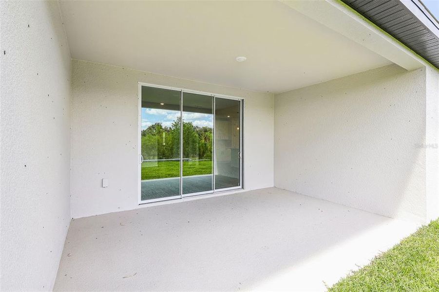 Exterior details and patio area of a home in The Grove at Stuart Crossing - Signature Series, Bartow (Image 17).