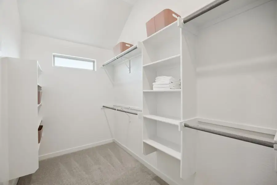 Primary Closet in the Diamond home plan by Trophy Signature Homes – REPRESENTATIVE PHOTO
