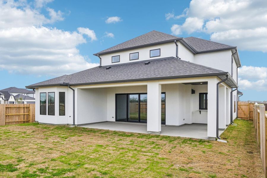 Exterior details and patio area of a home in Del Bello Lakes 60', Manvel (Image 4).