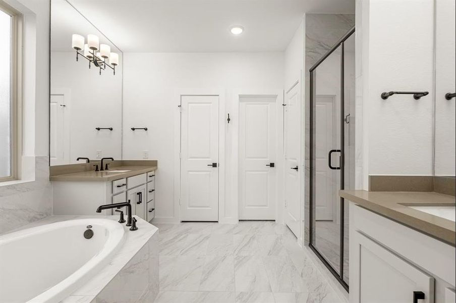 Enjoy this spa-like Main Bathroom with separate soaking tub and mud set shower with high-end design selections.