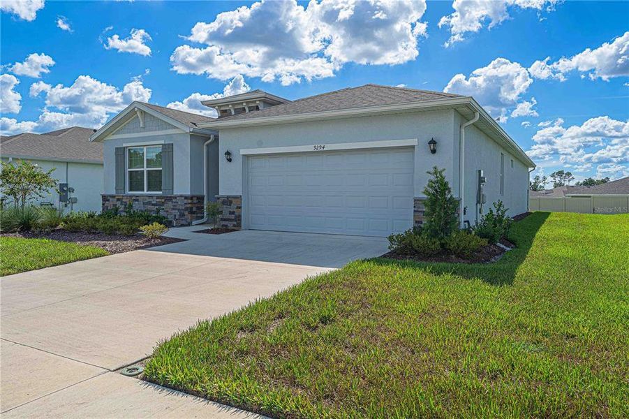 Front exterior of a new home in JB Ranch, Ocala, FL, highlighting curb appeal (Image 28).