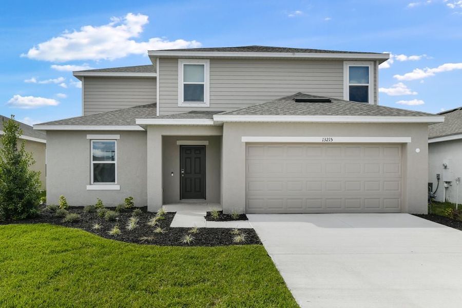 Front exterior of a new home in Firethorn, Parrish, FL, highlighting curb appeal (Image 1). Front exterior of a new home in Firethorn, Parrish, FL, highlighting curb appeal (Image 1).