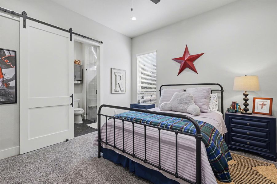 Bedroom #2 -Carpeted bedroom with ensuite bathroom, a barn door, ceiling fan, and recessed lighting