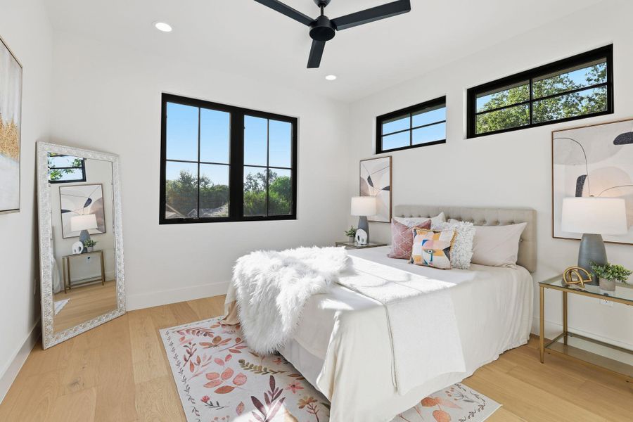 Bedroom featuring light wood finished floors, recessed lighting, and ceiling fan