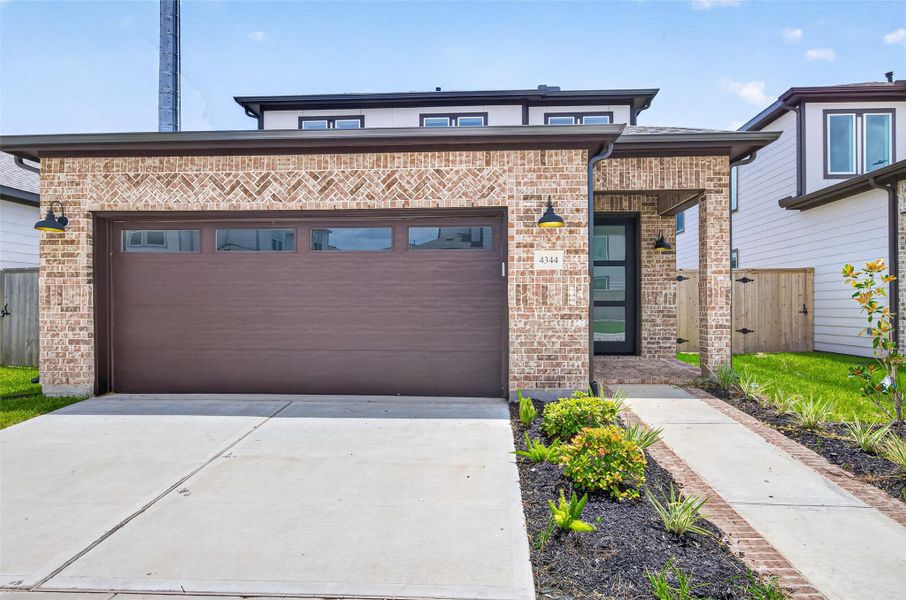 Front exterior of a new home in , Stafford, TX, highlighting curb appeal (Image 2). Front exterior of a new home in , Stafford, TX, highlighting curb appeal (Image 2).