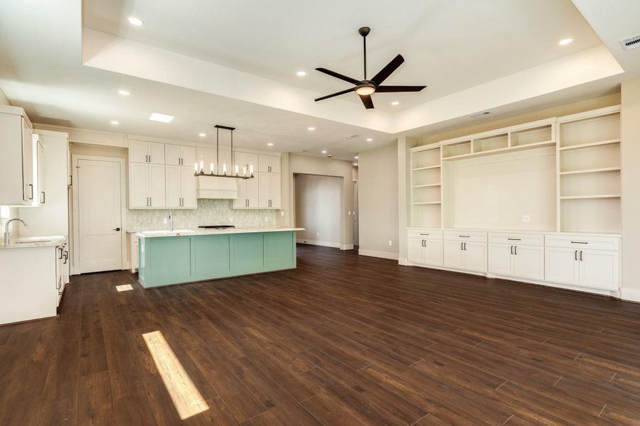 Tons of built ins surround the living room provide space for your library or your lifestyle photos. An open concept allows for flexibilty for anyone.