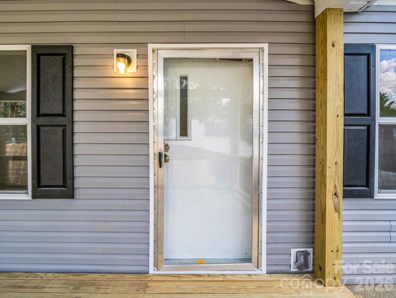 Exterior details and patio area of a home in , East Flat Rock (Image 18).