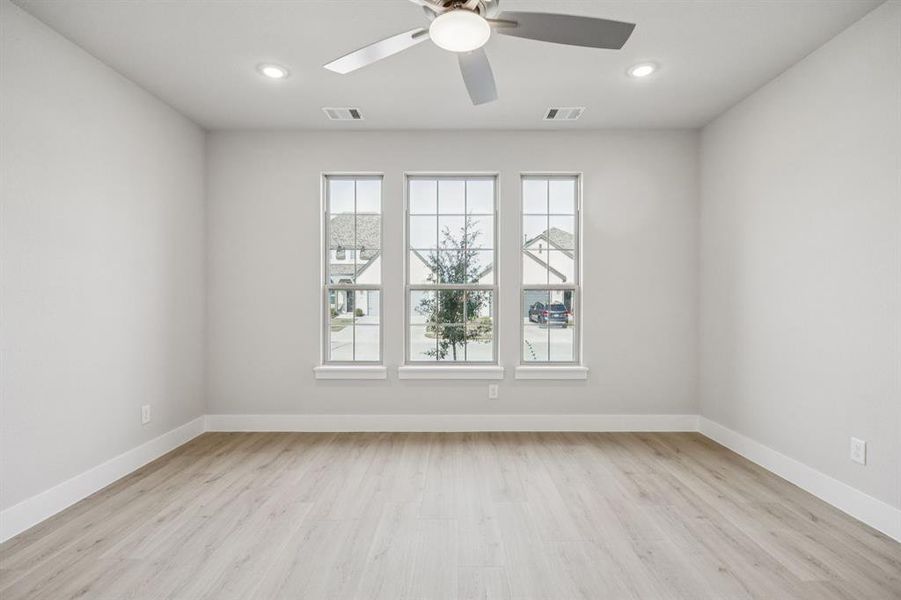 Unfurnished room featuring light wood-style floors and recessed lighting Unfurnished room featuring light wood-style floors and recessed lighting