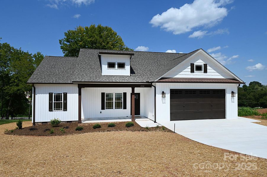 Front exterior of a new home in , Hickory, NC, highlighting curb appeal (Image 22).