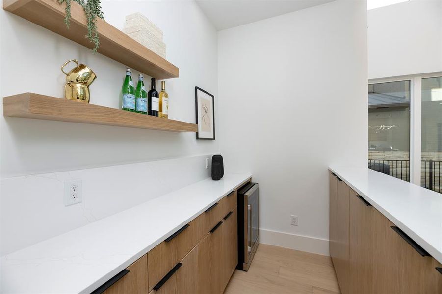 Bar area opening to Kitchen/Living area Bar area opening to Kitchen/Living area