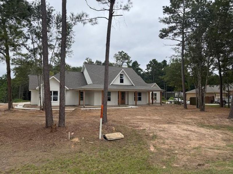 Exterior details and patio area of a home in , Splendora (Image 1).