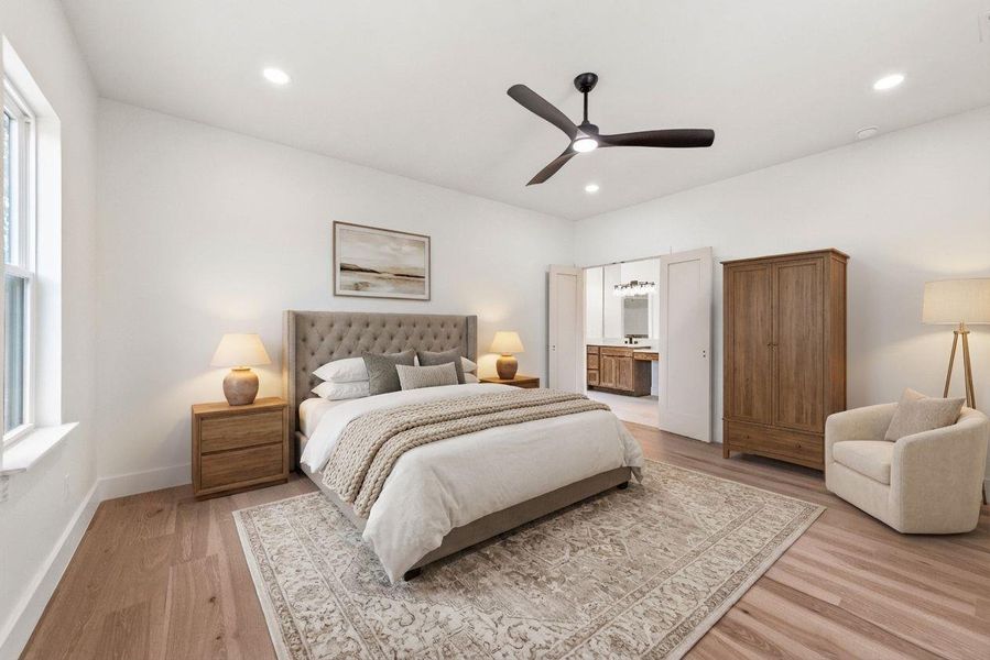 Nestled at the rear of the home, the primary bedroom provides a tranquil, private sanctuary.
