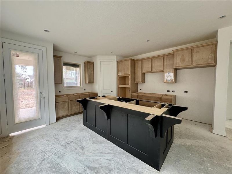 The two toned cabinets in the kitchen are so dramatic and ready to be styled